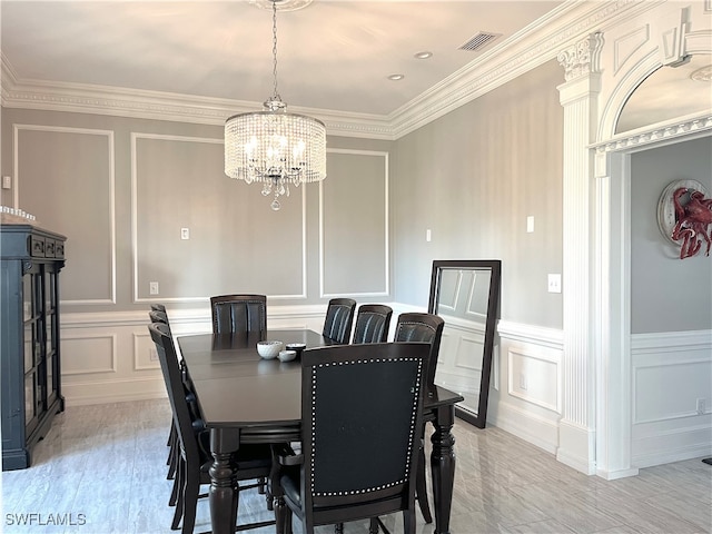 dining space featuring an inviting chandelier and ornamental molding