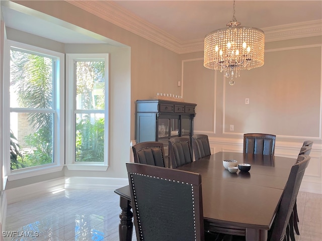 dining area featuring ornamental molding, an inviting chandelier, and a healthy amount of sunlight