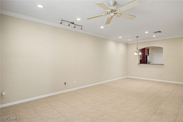 empty room featuring ceiling fan, light tile patterned floors, and ornamental molding