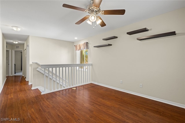 empty room with wood-type flooring and ceiling fan