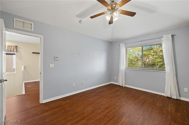 unfurnished room with dark wood-type flooring and ceiling fan