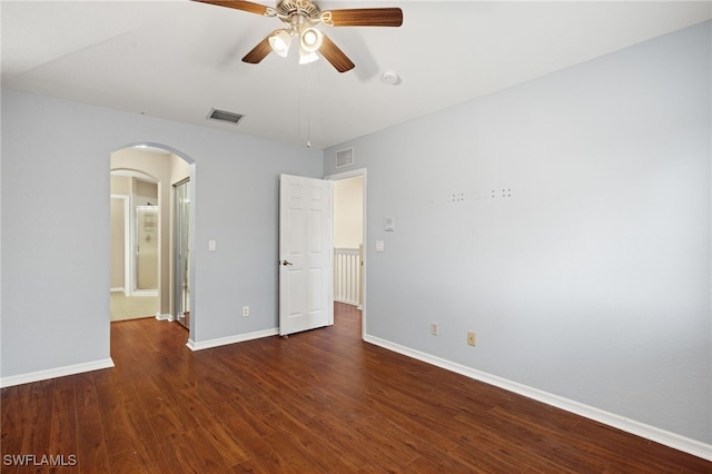 unfurnished bedroom with ceiling fan and dark hardwood / wood-style floors