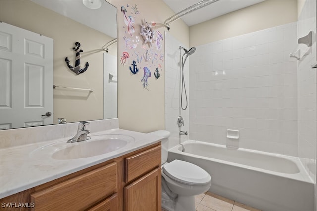 full bathroom featuring vanity, tile patterned floors, toilet, and tiled shower / bath