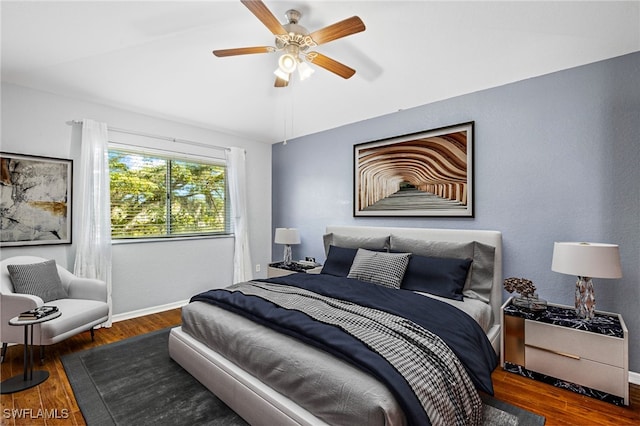 bedroom featuring ceiling fan and dark hardwood / wood-style floors