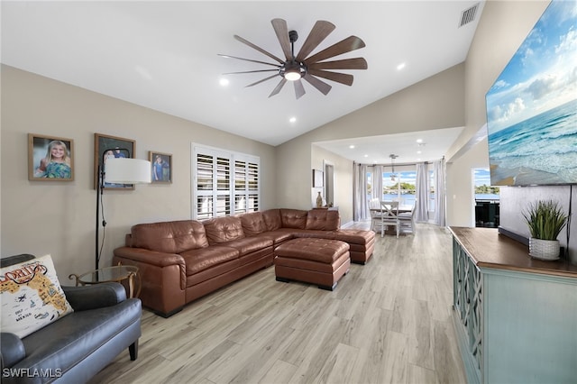 living room with high vaulted ceiling, ceiling fan, and light hardwood / wood-style flooring