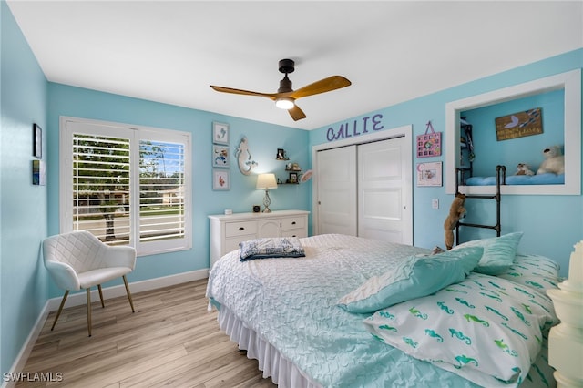 bedroom featuring a closet, ceiling fan, and light hardwood / wood-style flooring