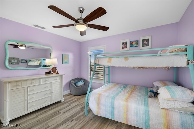 bedroom with light hardwood / wood-style flooring and ceiling fan