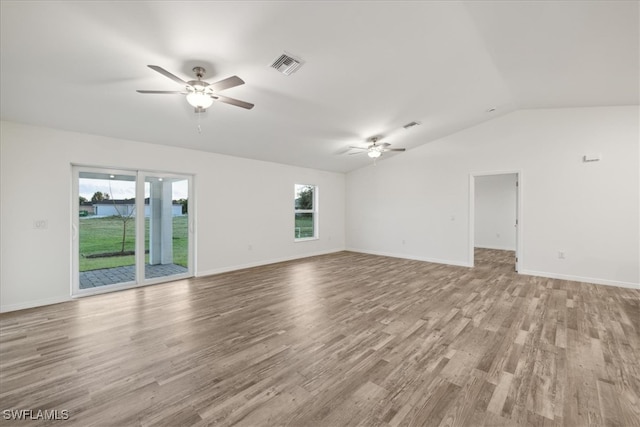 empty room with light wood-type flooring, lofted ceiling, and ceiling fan