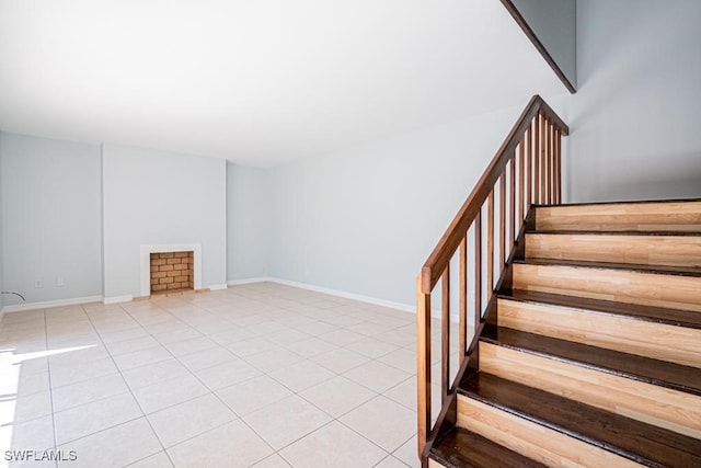 stairway with tile patterned floors