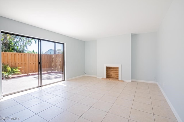 unfurnished living room with light tile patterned floors