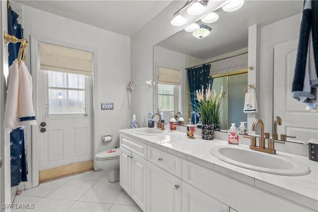 837 SW 2nd Ave, Cape Coral, FL 33991 - full bath with double vanity, tile patterned flooring, and a shower with curtain