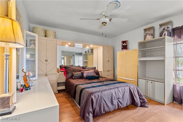 bedroom featuring ceiling fan and light wood-type flooring