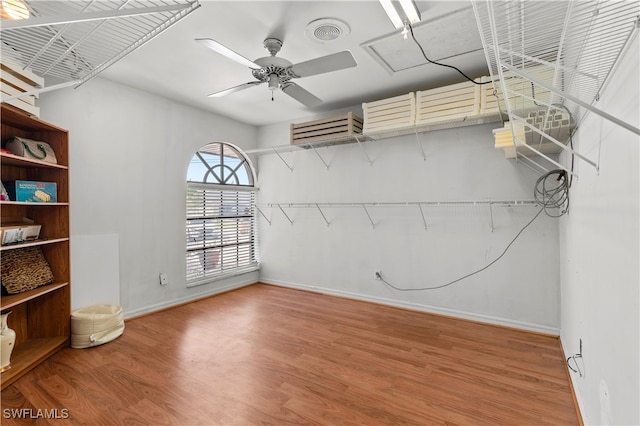 unfurnished room featuring ceiling fan and wood-type flooring