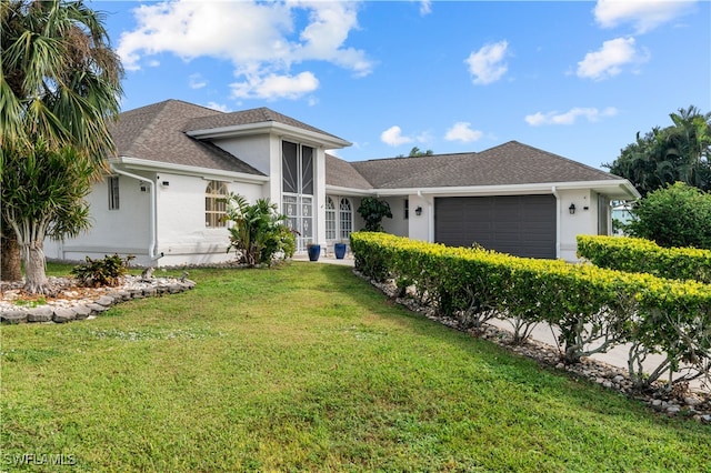 single story home with a garage and a front lawn