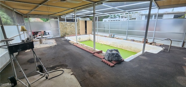 view of patio featuring glass enclosure