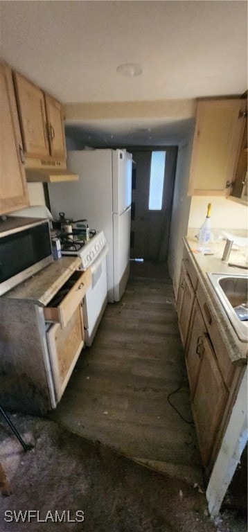 kitchen featuring gas range gas stove, light brown cabinetry, sink, and dark hardwood / wood-style flooring