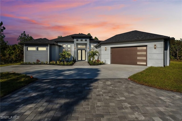 prairie-style house featuring a garage