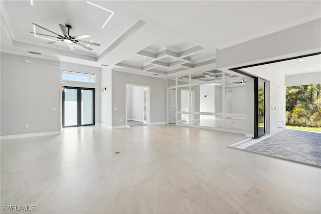 spare room featuring ceiling fan, beam ceiling, ornamental molding, and coffered ceiling