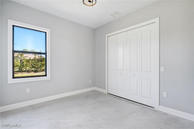 unfurnished bedroom with a closet