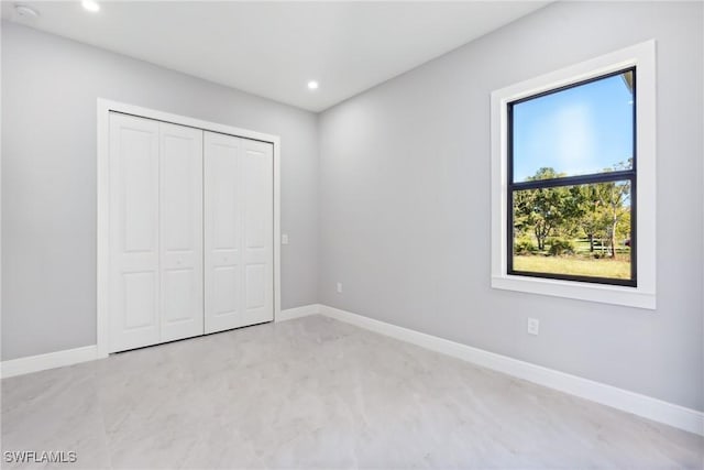 unfurnished bedroom with a closet