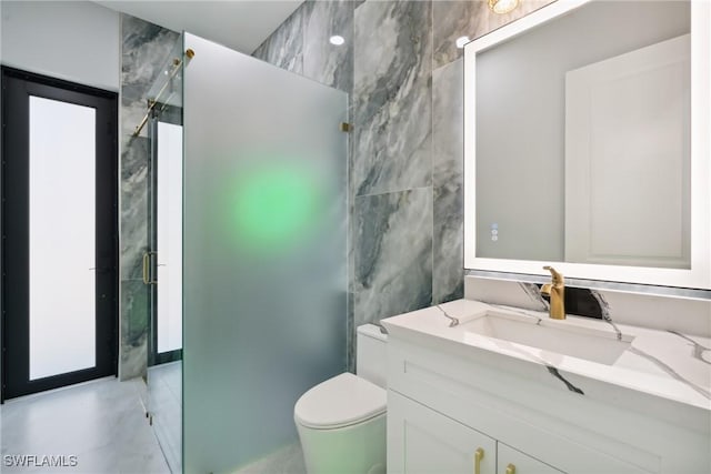 bathroom featuring vanity, an enclosed shower, tile walls, and toilet