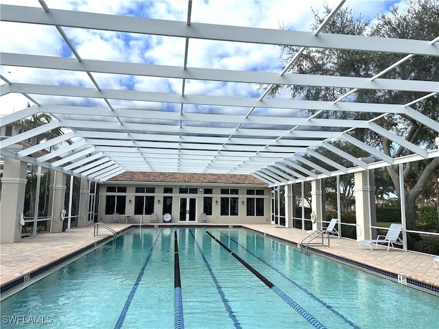 view of pool featuring a patio and glass enclosure