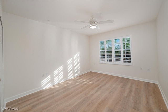 empty room featuring light hardwood / wood-style floors and ceiling fan