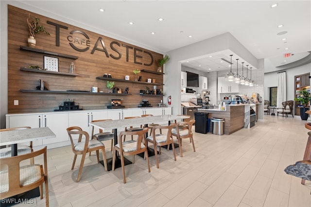 dining area with wooden walls