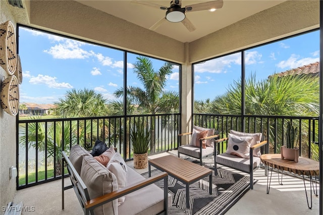 sunroom / solarium with a healthy amount of sunlight and ceiling fan