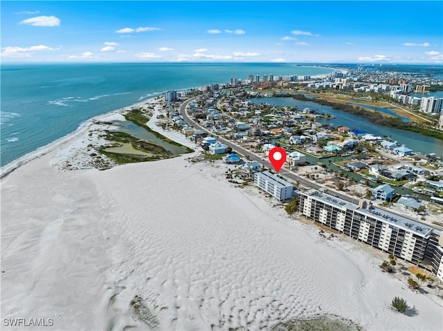 bird's eye view with a water view and a beach view