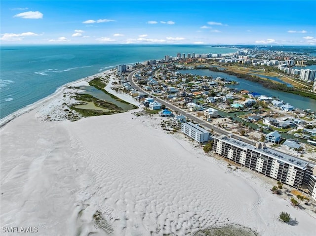 birds eye view of property featuring a water view, a city view, and a beach view