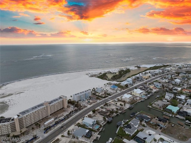 aerial view at dusk with a water view