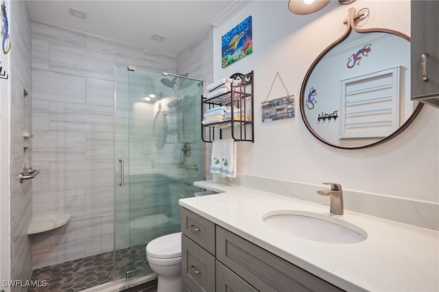 bathroom featuring walk in shower, vanity, and toilet