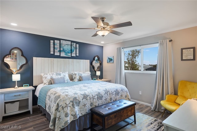 bedroom featuring dark hardwood / wood-style flooring, ceiling fan, and crown molding