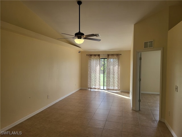 tiled spare room featuring high vaulted ceiling and ceiling fan