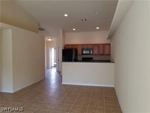 unfurnished living room featuring light tile patterned floors