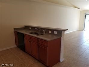 kitchen with dishwasher, sink, and light tile patterned flooring