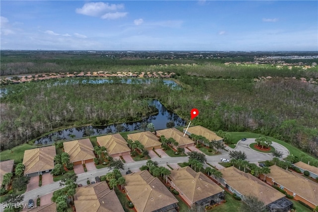 drone / aerial view with a water view and a residential view