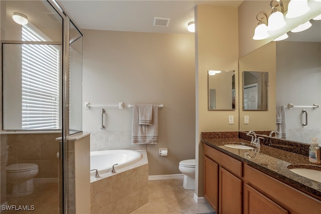 full bath featuring visible vents, toilet, a bath, tile patterned flooring, and a sink