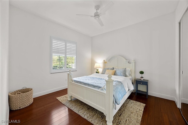 bedroom with dark wood-type flooring and ceiling fan