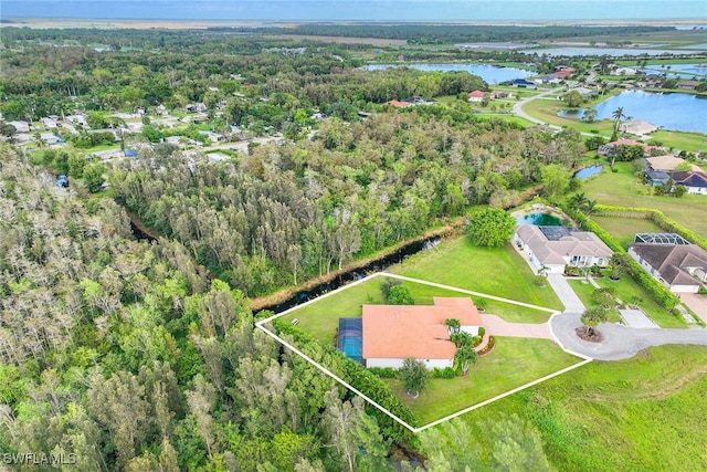 birds eye view of property with a water view