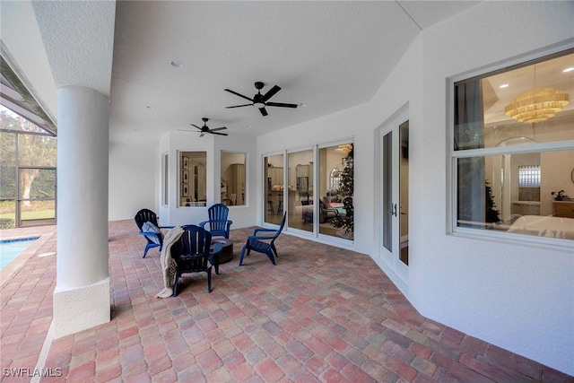 view of patio with a lanai and ceiling fan