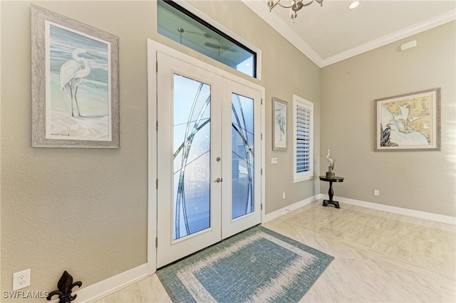 entryway featuring french doors and ornamental molding