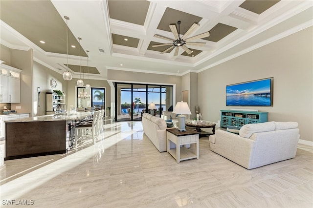 living room with a towering ceiling, beamed ceiling, ornamental molding, and coffered ceiling