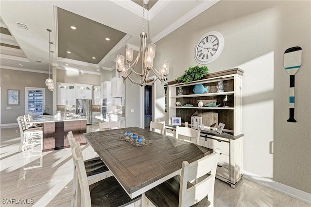 dining space featuring ornamental molding and sink