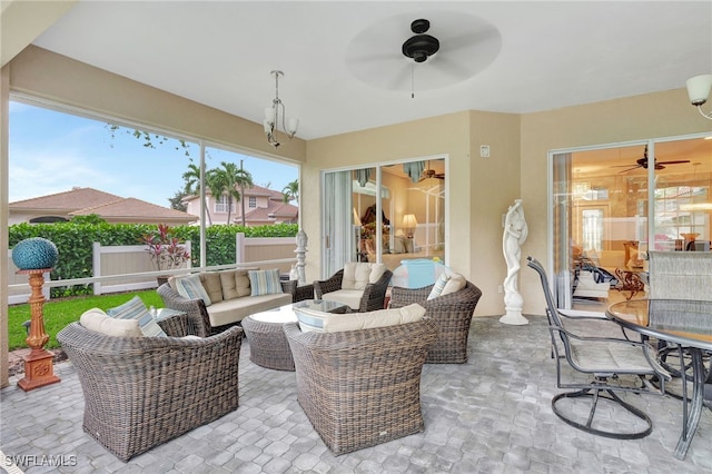 view of patio featuring an outdoor living space and ceiling fan