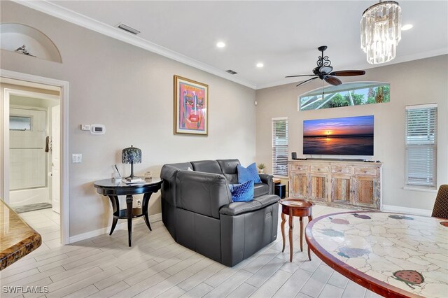 living room featuring ceiling fan with notable chandelier, light wood-type flooring, and crown molding