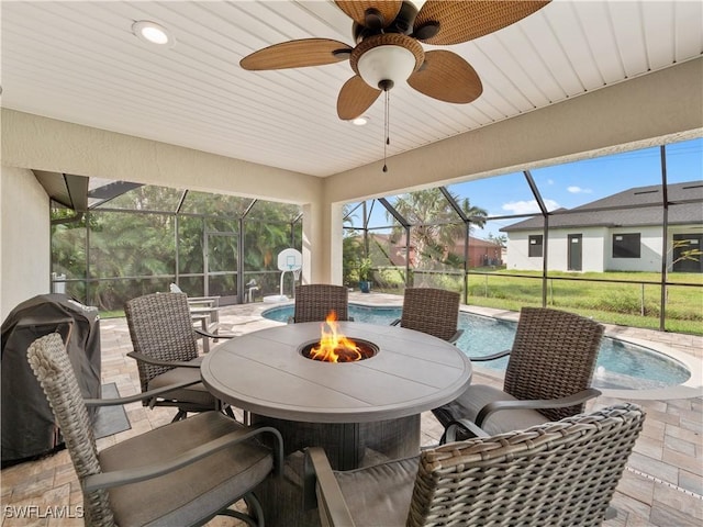 view of patio with glass enclosure