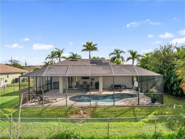 view of pool featuring a lanai, a yard, and a patio