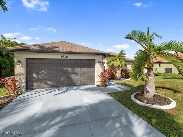 single story home featuring a front yard and a garage